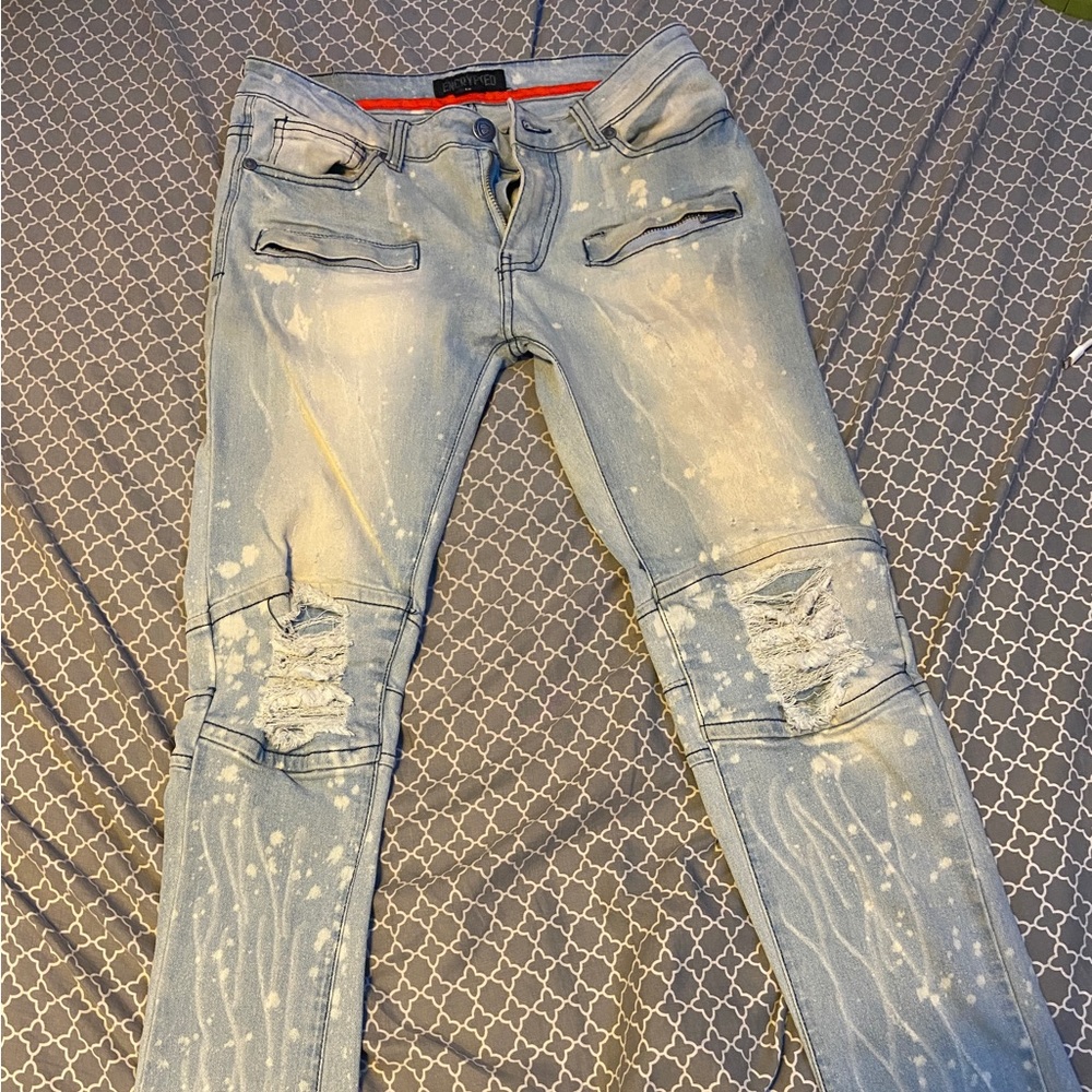 Blue ripped encrypted jeans for sale !!